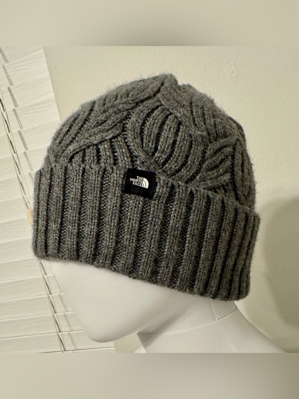 The North Face. Women's grey cuffed beanie with a textured knit pattern